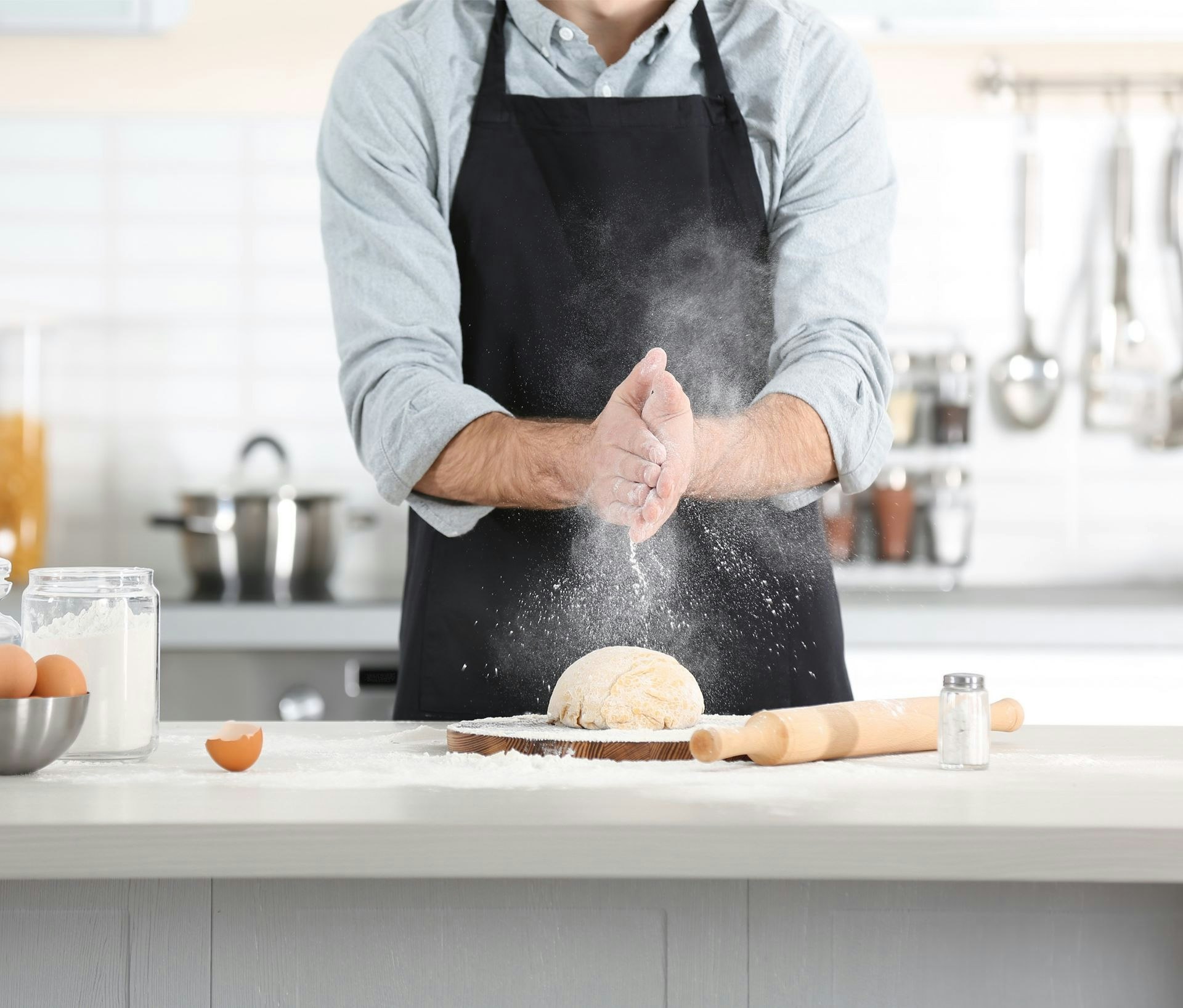 Man preparing pasta on kitchen table